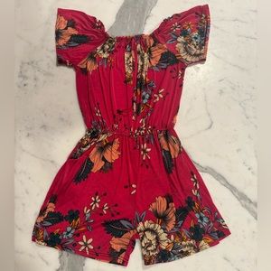 beachy pink romper with gorgeous flowers. cinched waist. with pockets